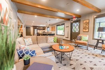 a living room with a couch and a table